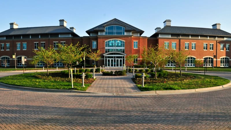 Modern brick building with roundabout entrance.